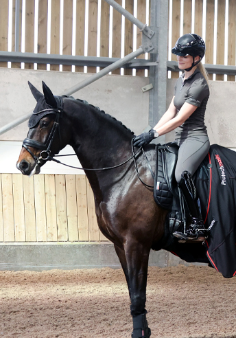 woman on a horse doing the heart sign 