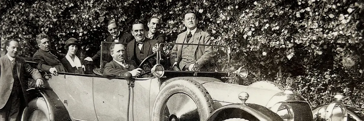 Harry Hall (far right) pictured with contemporaries in a Bentley car in the early 20th century, reflecting his connections within high society.