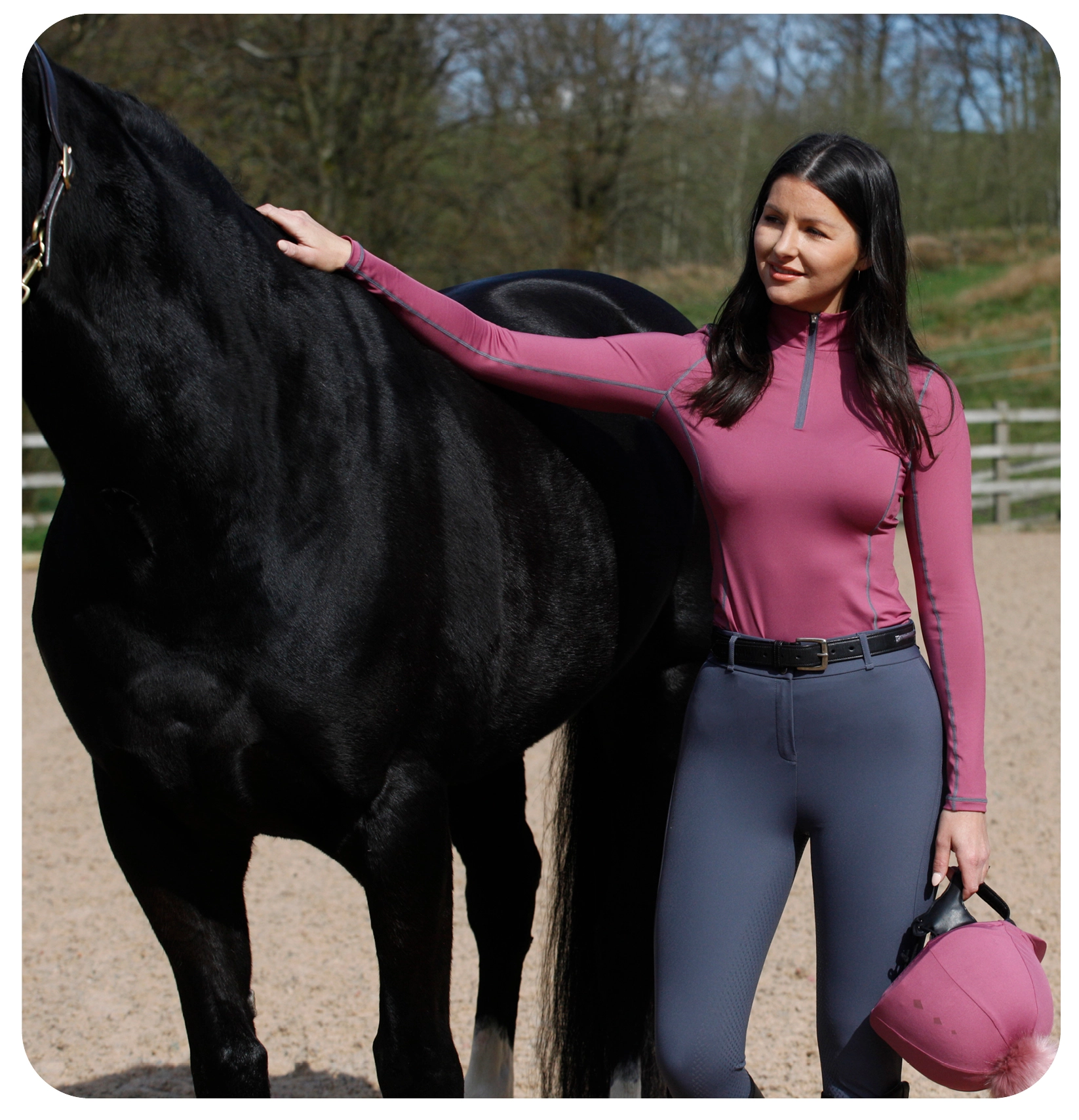 woman on a horse doing the heart sign 