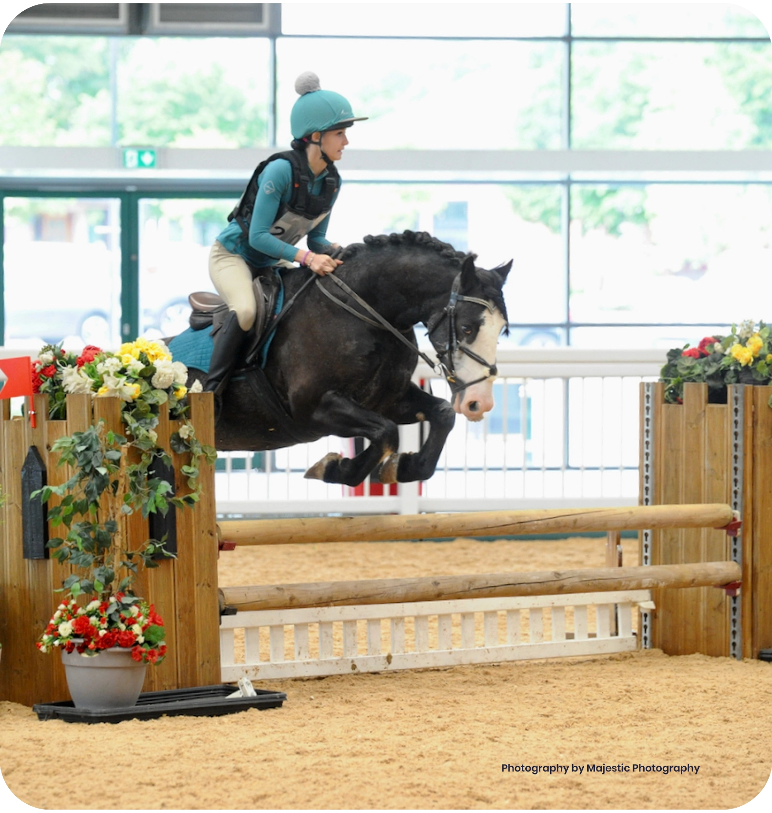 woman on a horse doing the heart sign 