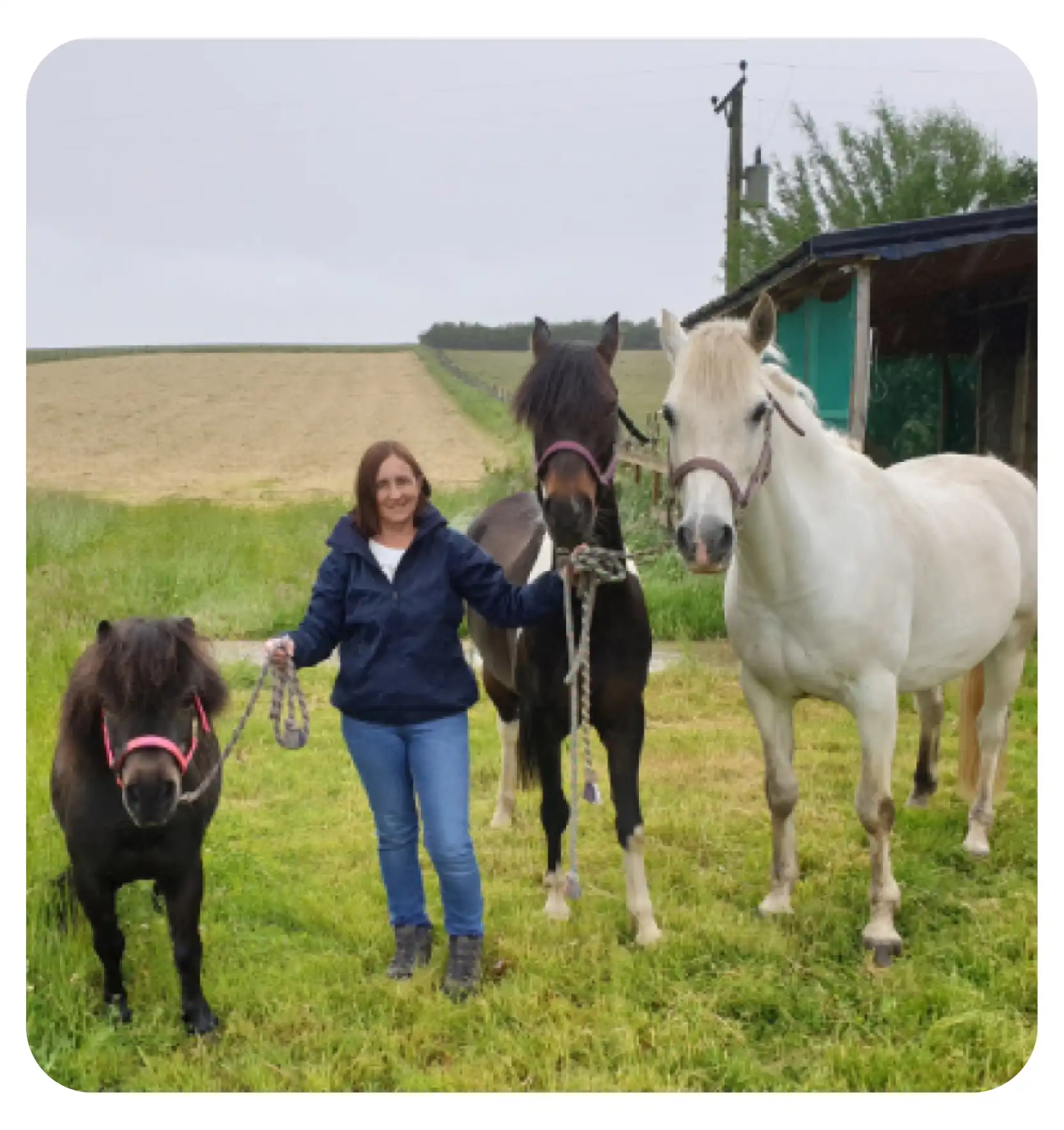 woman on a horse doing the heart sign