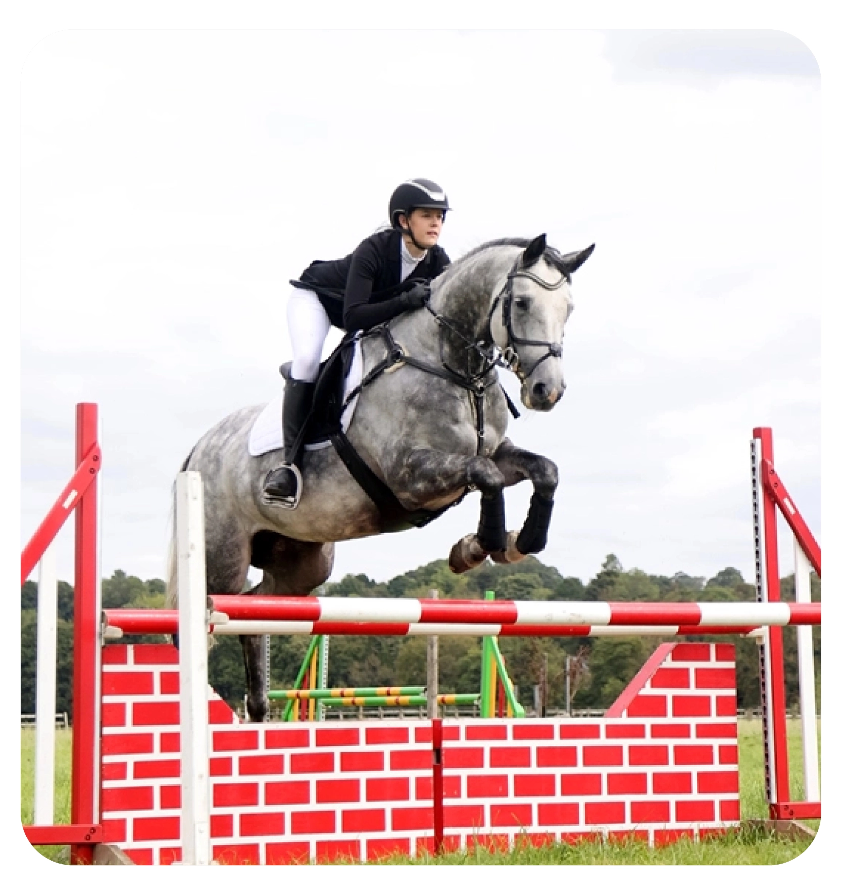 woman on a horse doing the heart sign 