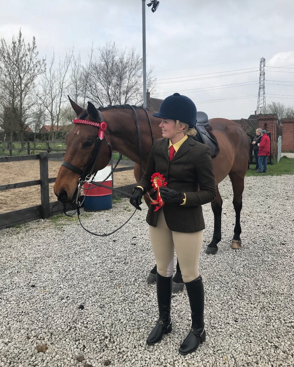 horse rider at a event with her horse