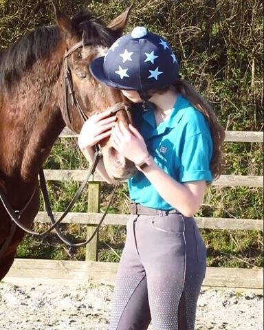 girl hugging a horse