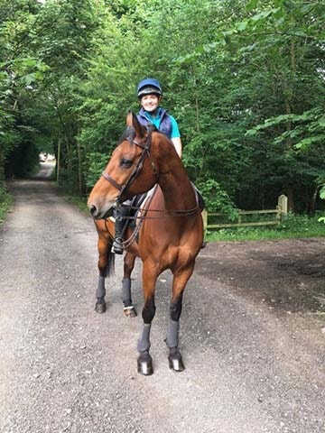 horse rider riding her horse