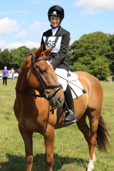 horse rider riding her horse